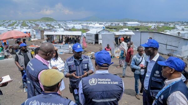 WHO workers on the ground at the Lushagala II IDP camp in Goma, DRC, assessing patient care and identifying treatment needs. - Sputnik Africa