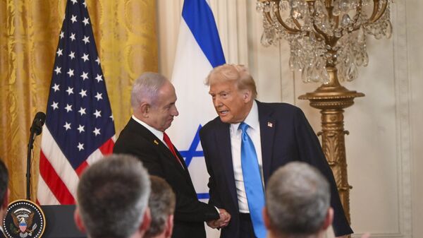 United States President Donald Trump (R) and Israeli Prime Minister Benjamin Netanyahu (L) shake hands as they leave following a joint press conference in the East Room at the White House in Washington, D.C., United States on February 04, 2025. - Sputnik Africa