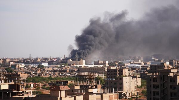 Smoke rises over the frontline, where clashes between the army and the Rapid Support Forces (RSF) take place in Khartoum, Sudan on December 27, 2024. - Sputnik Africa