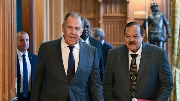 Russian Foreign Minister Sergey Lavrov and Sudanese Foreign Minister Ali Youssef Al-Sharif (right) during a meeting in Moscow. - Sputnik Africa