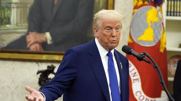 President Donald Trump speaks as Tulsi Gabbard is sworn in as the Director of National Intelligence in the Oval Office of the White House, Wednesday, Feb. 12, 2025, in Washington. - Sputnik Africa