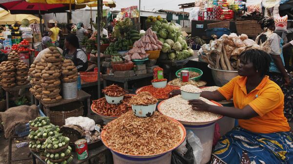 Women sell vegetables and other food in a market on World Food Day in Lagos, Nigeria, Tuesday, Oct. 16, 2012. - Sputnik Africa