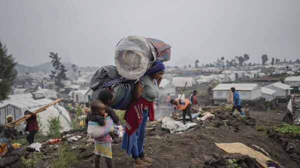 People who were displaced by the fighting between M23 rebels and government soldiers leave their camp following an instruction by M23 rebels in Goma, Democratic Republic of the Congo, Tuesday, Feb. 11, 2025. - Sputnik Africa