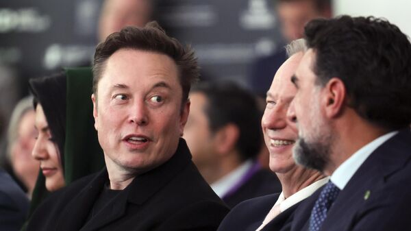 Elon Musk arrives before President Donald Trump speaks at the Future Investment Initiative (FII) Institute summit in Miami Beach, Fla., Wednesday, Feb. 19, 2025.  - Sputnik Africa