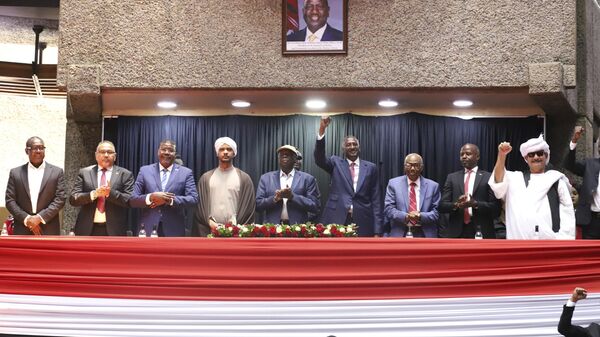 Representatives of Rapid Support Forces (RSF) sing during a planned signing ceremony of the Sudan Founding Charter aimed at establishing a unity government involving leaders of political forces, armed groups, and the Rapid Support Forces (RSF) at the Kenyatta International Convention Centre (KICC) in Nairobi, Tuesday, Feb. 18, 2025. - Sputnik Africa