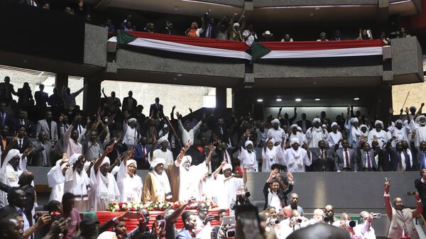 Delegates sing during a planned signing ceremony of the Sudan Founding Charter aimed at establishing a unity government involving leaders of political forces, armed groups, and the Rapid Support Forces (RSF) at the Kenyatta International Convention Centre (KICC) in Nairobi, Tuesday, Feb. 18, 2025. - Sputnik Africa