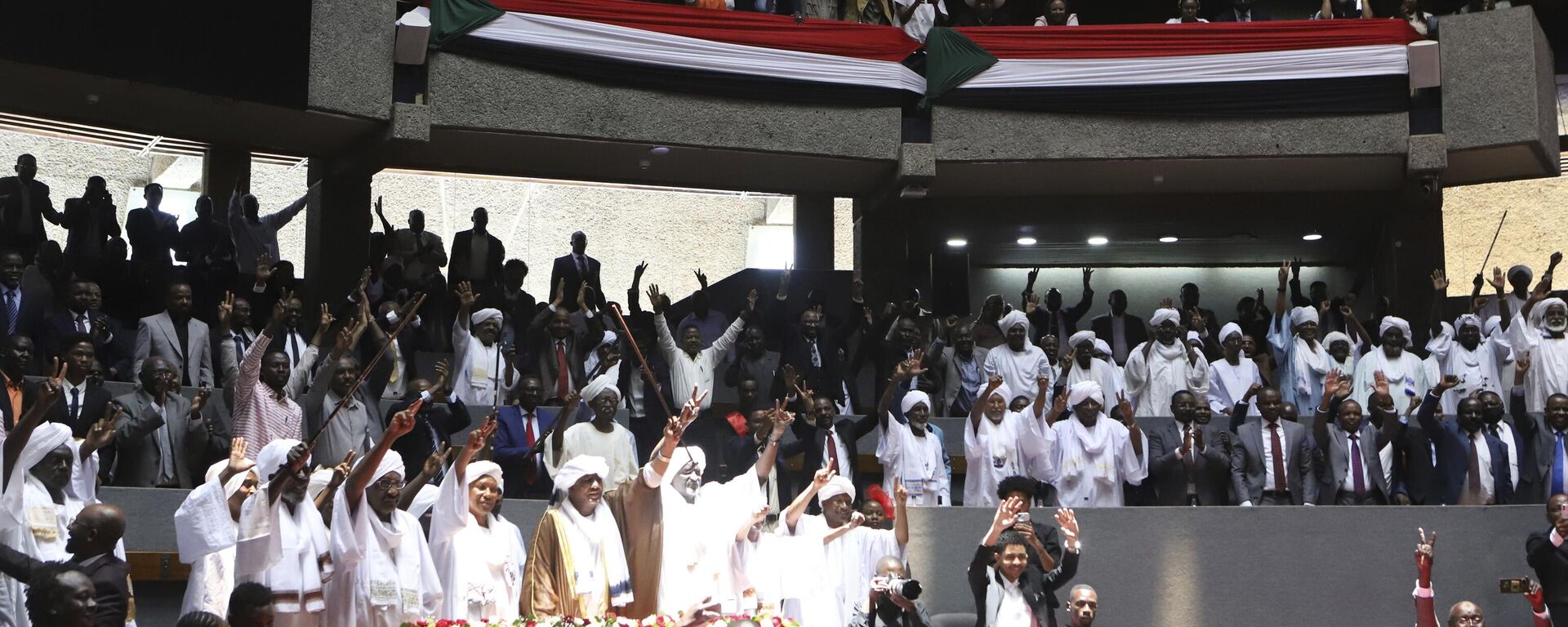 Delegates sing during a planned signing ceremony of the Sudan Founding Charter aimed at establishing a unity government involving leaders of political forces, armed groups, and the Rapid Support Forces (RSF) at the Kenyatta International Convention Centre (KICC) in Nairobi, Tuesday, Feb. 18, 2025. - Sputnik Africa, 1920, 21.02.2025