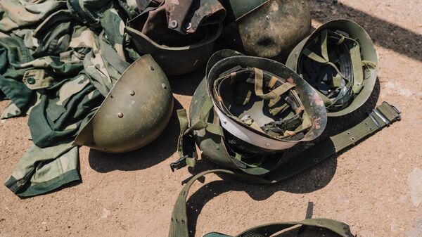 M23 rebel officials confiscate clothing, helmets and armaments from an abandoned Congolese National Police post on February 20, 2025 in Bukavu, Democratic Republic of Congo.  - Sputnik Africa