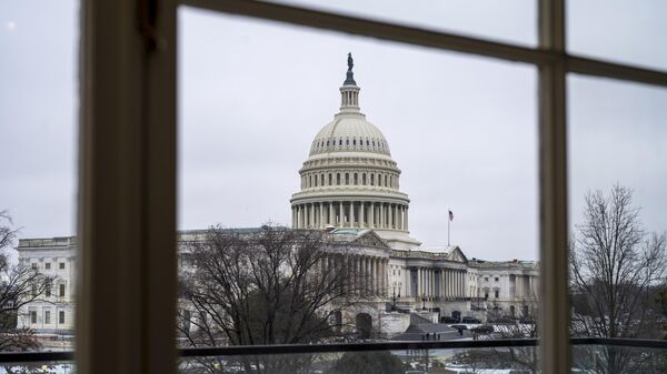 The Capitol is seen framed through a window in the Cannon House Office Building on Capitol Hill in Washington, Thursday, Feb. 13, 2025. - Sputnik Africa