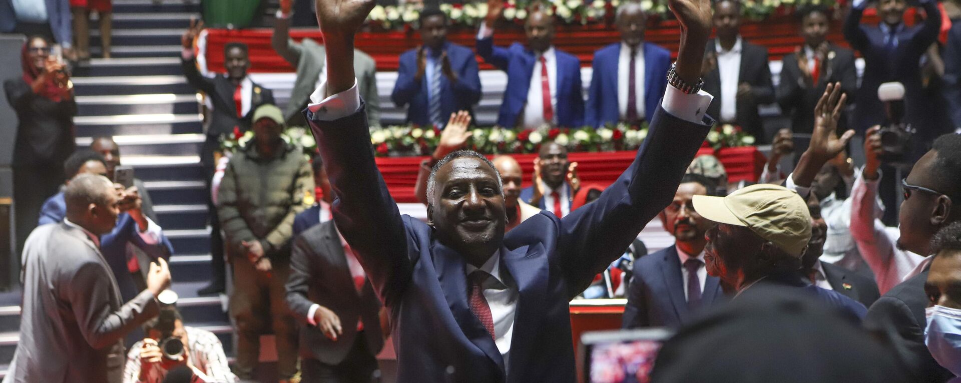 Rapid Support Forces (RSF) deputy commander Abdul Rahim Dagalo, gestures as he arrives for a planned signing ceremony of the Sudan Founding Charter aimed at establishing a unity government involving leaders of political forces, armed groups, and the Rapid Support Forces (RSF) at the Kenyatta International Convention Centre (KICC) in Nairobi, Tuesday, Feb. 18, 2025.  - Sputnik Africa, 1920, 23.02.2025