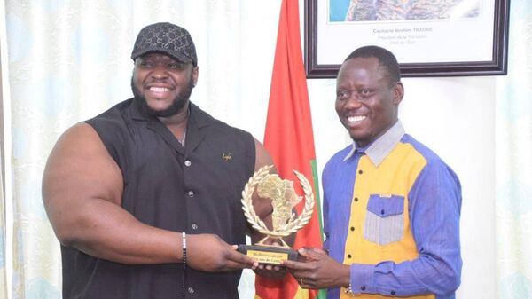 Burkinabe athlete Iron Biby, whose real name is Cheick Ahmed Al-Hassan Sanou, receiving an award Best African sportsman of the year 2024. February 21, 2025. - Sputnik Africa