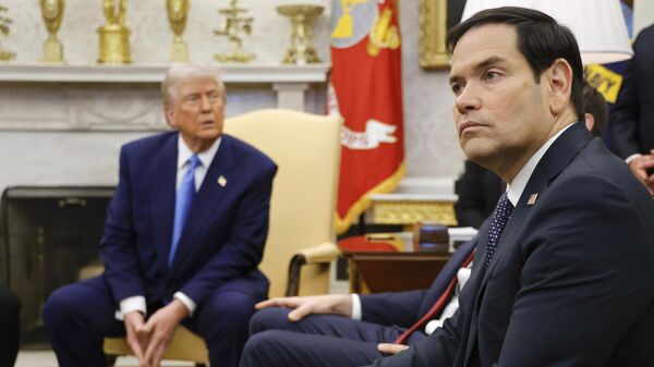 Secretary of State Marco Rubio, right, listens as President Donald Trump, left, meets with France's President Emmanuel Macron in the Oval Office of the White House in Washington, Monday, Feb. 24, 2025. - Sputnik Africa