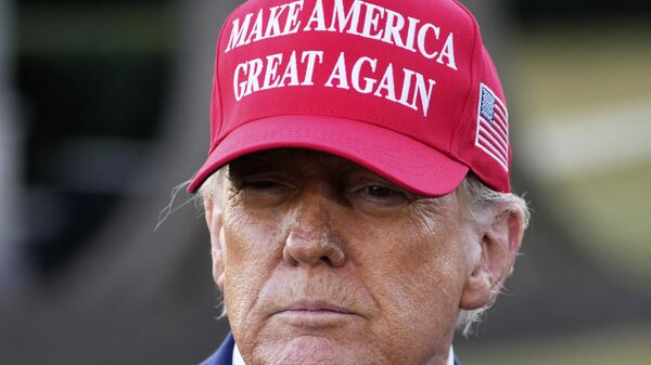 President Donald Trump talks with reporters before boarding Marine One on the South Lawn of the White House in Washington, Friday, Feb. 28, 2025. - Sputnik Africa