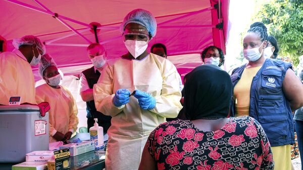 A health worker prepares to administer a vial of a vaccine against the Sudan strain of Ebola, during a trial, at Mulago Referral Hospital, in Kampala, Uganda Monday, Feb. 3, 2025. - Sputnik Africa