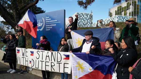 Supporters of Rodrigo Duterte living in The Netherlands and Belgium gather outside the International Criminal Court - Sputnik Africa