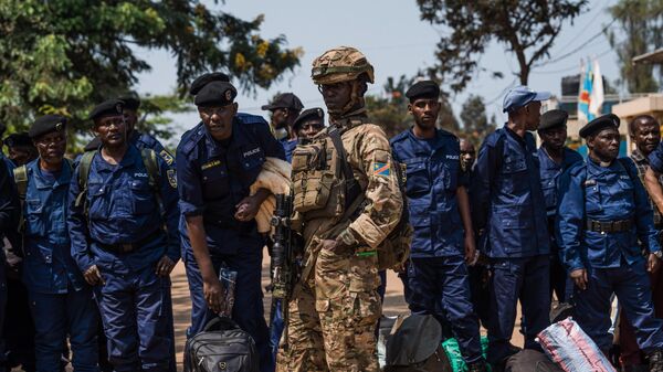 M23 rebels guard a unit of surrendering Congolese police officers who will be recruited into the rebel group on February 22, 2025 in Bukavu, Democratic Republic of Congo. - Sputnik Africa