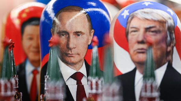 Matryoshka dolls with images of Russian President Vladimir Putin and US President Donald Trump in a souvenir shop in Moscow. - Sputnik Africa