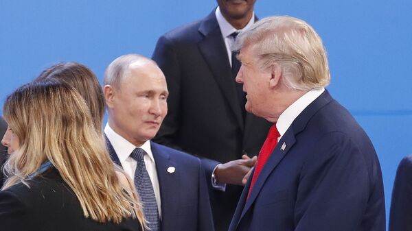 President Donald Trump, right, walk past Russia's President Vladimir Putin, left, as they gather for the group photo at the start of the G20 summit in Buenos Aires, Argentina, Friday, Nov. 30, 2018 - Sputnik Africa