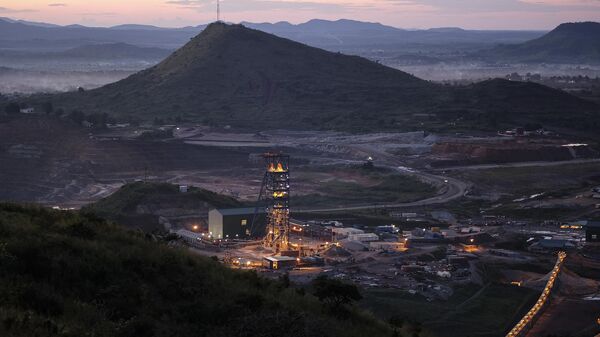 The mine shaft used to access underground excavation tunnels sits illuminated at a gold mine in Democratic Republic of Congo. - Sputnik Africa