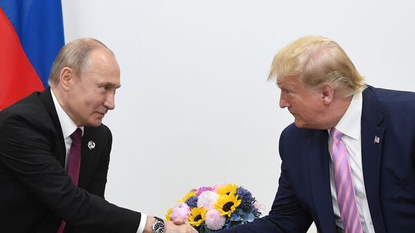 Russian President Vladimir Putin and U.S. President Donald Trump shake hands during a bilateral meeting at the at the Group of 20 (G20) leaders summit in Osaka, Japan. - Sputnik Africa