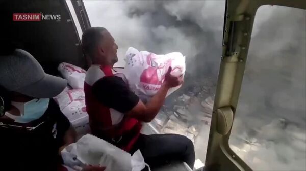 #viral | A dangerous moment occurred when plumes of smoke were emitted during a Red Crescent helicopter’s operation to extinguish a fire at Shahid Rajaee Port in Bandar Abbas - Sputnik Africa