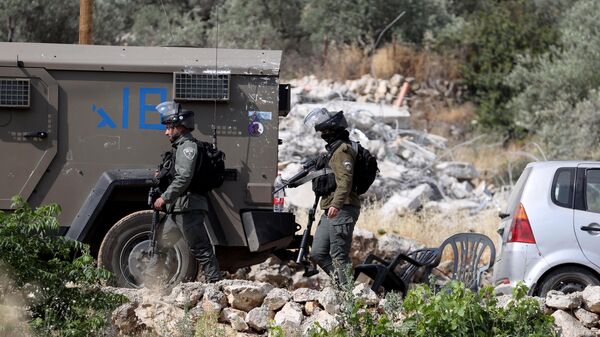 Israeli forces' bulldozers demolish a house in Kibya town of Ramallah city in the West Bank on April 29, 2025. - Sputnik Africa