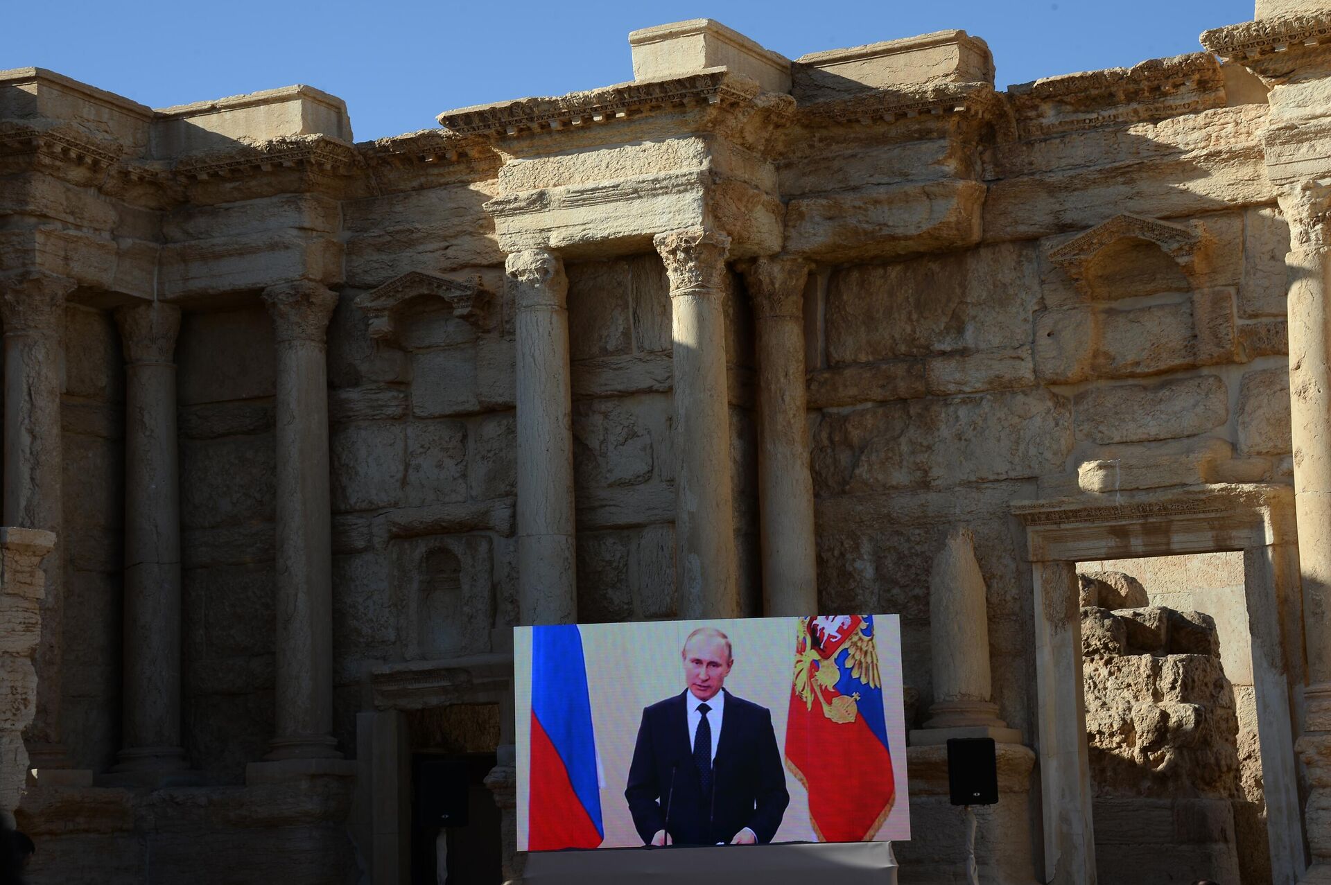 Broadcast of an address by Russian President Vladimir Putin in the Roman Amphitheater of Syrian Palmyra, liberated from the terrorists of the ISIS* Broadcast of an address by Russian President Vladimir Putin in the Roman Amphitheater of Syrian Palmyra, liberated from the terrorists of the ISIS* - Sputnik Africa, 1920, 07.05.2025
