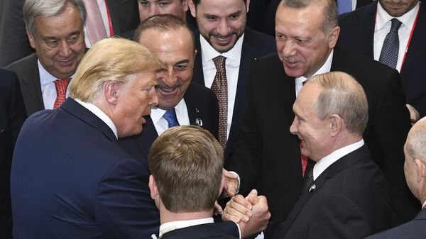 US President Donald Trump, left, shakes hands with Russian President Vladimir Putin, right, as Turkey's President Recep Tayyip Erdogan. - Sputnik Africa