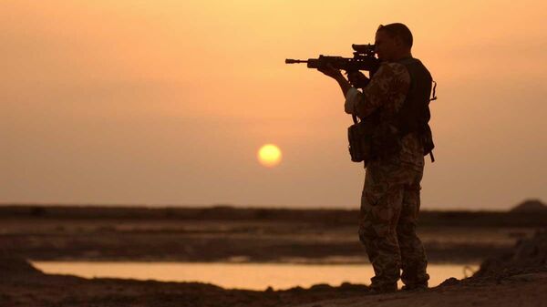 A Royal Marine from 42 Commando stands guard over a UK USA coalition held position on the Al Faw peninsular, in Iraq, March 23 2003.  - Sputnik Africa