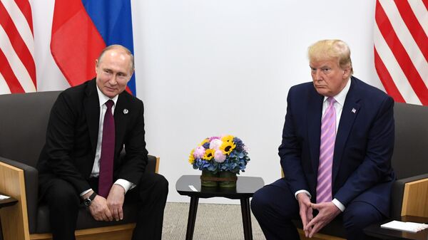 Russian President Vladimir Putin and US President Donald Trump during a meeting on the sidelines of the G20 summit in Osaka on June 28, 2019. - Sputnik Africa