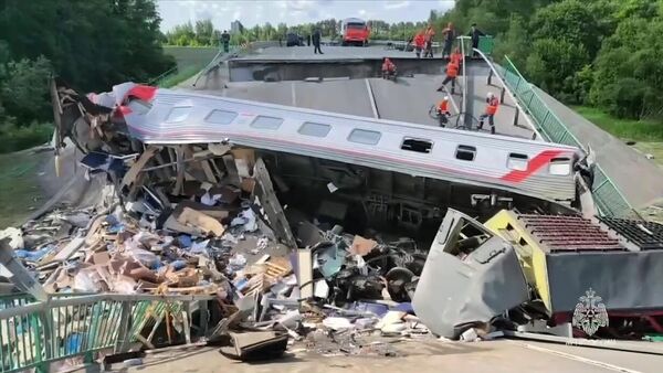 One of the carriages of the Klimov-Moscow train, crushed by a collapsed bridge in the Bryansk region. On May 1, 2025, at 10:50 p.m. on the Vygonichi-Pilshino railway section in the Bryansk region, as a result of an explosion, the structure of a road bridge collapsed, the debris of which fell on a passenger train passing underneath it. - Sputnik Africa