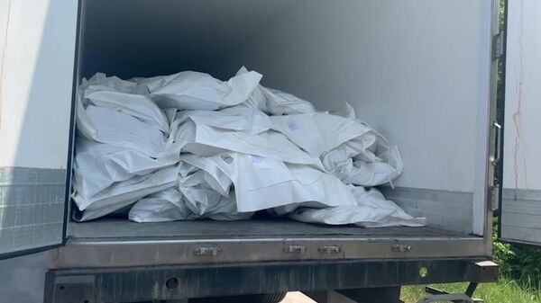 A refrigerator with the bodies of dead Ukrainian servicemen at the Novaya Guta checkpoint in Belarus. - Sputnik Africa