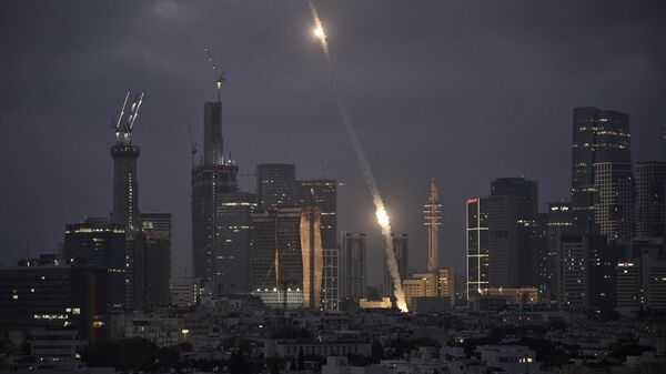 Israel's Iron Dome air defense system fires to intercept projectiles over Tel Aviv, Saturday, June 14, 2025. - Sputnik Africa