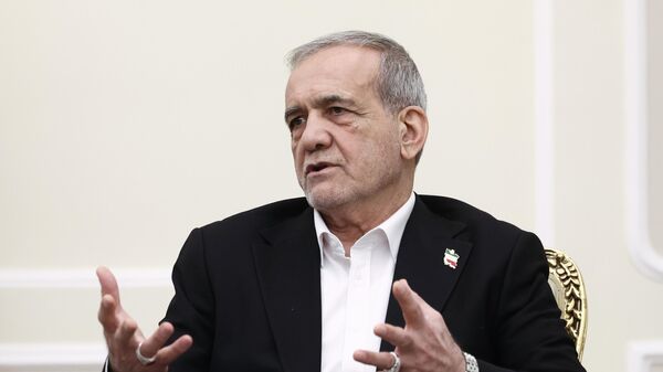 Iranian President Masoud Pezeshkian during a meeting with Russian Deputy Prime Minister Alexei Overchuk in Tehran. - Sputnik Africa