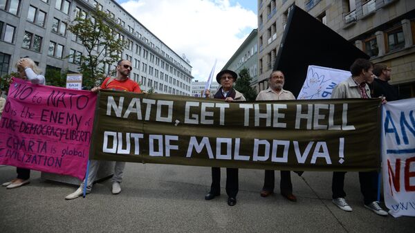 Participants in a protest against the NATO summit in Warsaw. - Sputnik Africa