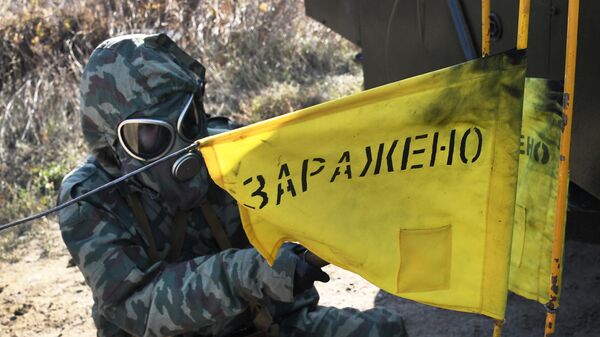A serviceman of the NBC reconnaissance unit during a survey of an area to detect toxic substances during exercises of the NBC protection unit of the Pacific Fleet. - Sputnik Africa