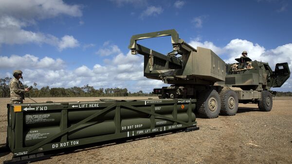 In this image provided by the U.S. Army, U.S. Army Sgt. Ian Ketterling, gunner for Alpha Battery, 1st Battalion, 3rd Field Artillery Regiment, 17th Field Artillery Brigade, prepares the crane for loading the Army Tactical Missile System (ATACMS) on to the High Mobility Artillery Rocket System (HIMARS) in Queensland, Australia, July 26, 2023.  - Sputnik Africa