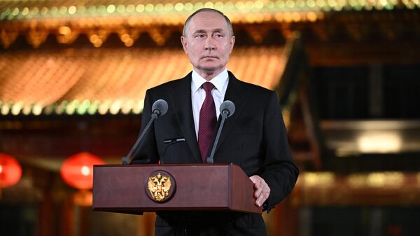 Russian President Vladimir Putin approaches media representatives at the Diaoyutai Palace in Beijing on September 3, 2025. - Sputnik Africa