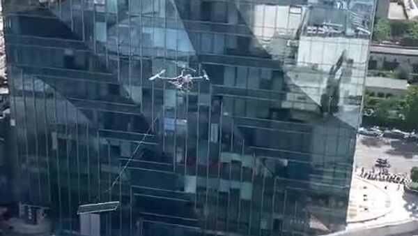 Des drones industriels remplacent des grues en Chine - Sputnik Afrique