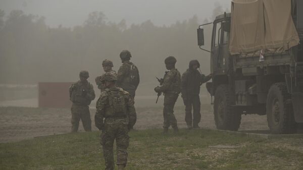 American soldiers are seen during a high-intensity training session at the Nowa Deba training ground on May 06, 2023 in Nowa Deba, Poland. - Sputnik Africa