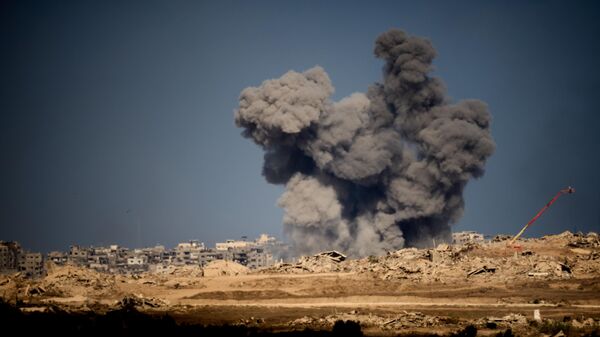 Smoke rises to the sky following an Israeli military strike in the Gaza Strip, as seen from southern Israel, Friday, Oct. 10, 2025, after Israel and Hamas have agreed to a pause in their war and the release of the remaining hostages. - Sputnik Africa