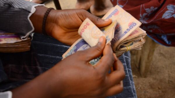 Settling Int'l Trade in National Currencies Will 'Liberate Africa From Its Peripheral Role' West Enabled: Nigerian Expert - Sputnik Africa