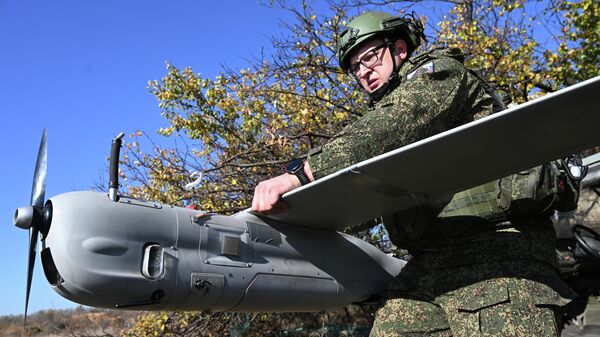 A Russian serviceman from the Orlan-10 reconnaissance UAV crew of the Center battlegroup prepares the drone for launch in the Krasnoarmeysk direction in the SMO zone. - Sputnik Africa
