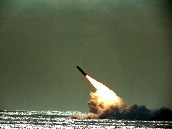 The archive photo shows the launch of a Trident II, D-5 missile from the USS Tennessee submarine submerged in the Atlantic Ocean off the coast of Florida. - Sputnik Africa