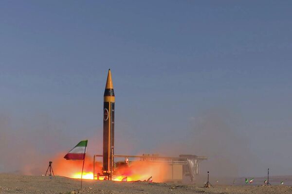 In this photo released by the Iranian Defense Ministry on May 25, 2023, Khorramshahr-4 missile is launched at an undisclosed location, Iran (Iranian Defense Ministry via AP) - Sputnik Africa