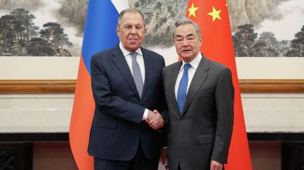 Sergey Lavrov meets with Chinese Foreign Minister Wang Yi in Beijing, April 14, 2026. - Sputnik Africa