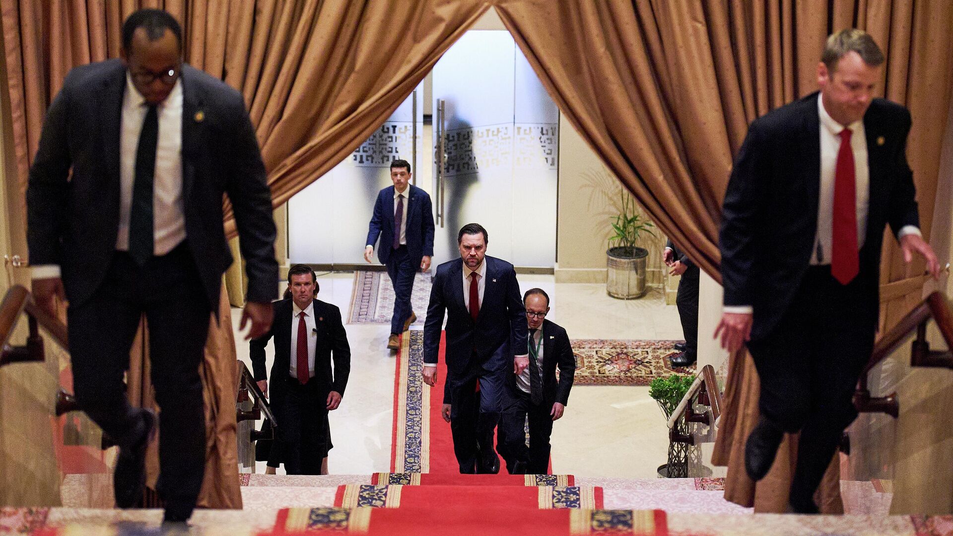 U.S. Vice President JD Vance, center, walks up a flight of stairs to meet with Pakistan's Prime Minister Shehbaz Sharif, Saturday, April 11, 2026, in Islamabad, for talks about Iran. U.S. Vice President JD Vance, center, walks up a flight of stairs to meet with Pakistan's Prime Minister Shehbaz Sharif, Saturday, April 11, 2026, in Islamabad, for talks about Iran. - Sputnik Africa, 1920, 14.04.2026