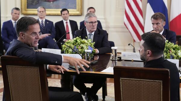 NATO Secretary General Mark Rutte, foreground left, speaks as Ukrainian President Volodymyr Zelenskyy, foreground right, British Prime Minister Keir Starmer, center left, and France's President Emmanuel Macron, center right - Sputnik Africa