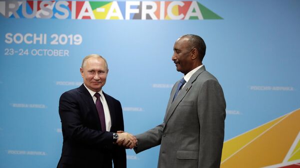 Russian President Vladimir Putin and Chairman of the Supreme (Sovereign) Council of the Republic of Sudan Abdel Fattah al‑Burhan during a meeting on the sidelines of the Russia-Africa summit on October 23, 2019. - Sputnik Africa