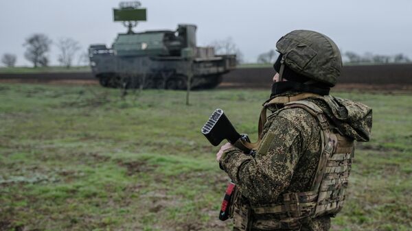 A Russian serviceman of the Dnepr Group of Forces serving a Tor-M2 surface-to-air missile system at a combat position in the Zaporozhye sector of the front line amid Russia's military operation in Ukraine. - Sputnik Africa